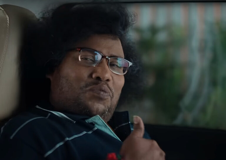 ACKO நிறுவன விளம்பரப் படத்தில் யோகி பாபு மற்றும் கெளதம் மேனன்