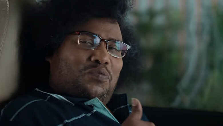 ACKO நிறுவன விளம்பரப் படத்தில் யோகி பாபு மற்றும் கெளதம் மேனன்